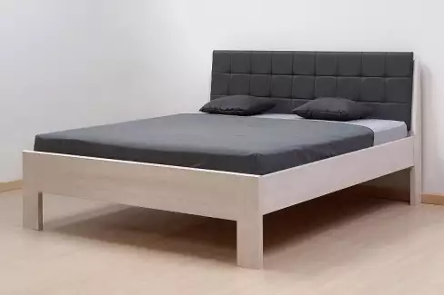 Postel Danny s čalouněným čelem z průběžného dubu