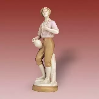 Porcelánová figura vážící 300 g Muž se džbánem