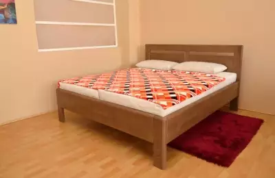 Masivní buková nebo dubová postel v rozměrech 90 x 200 cm až 200 x 200 cm Nonna